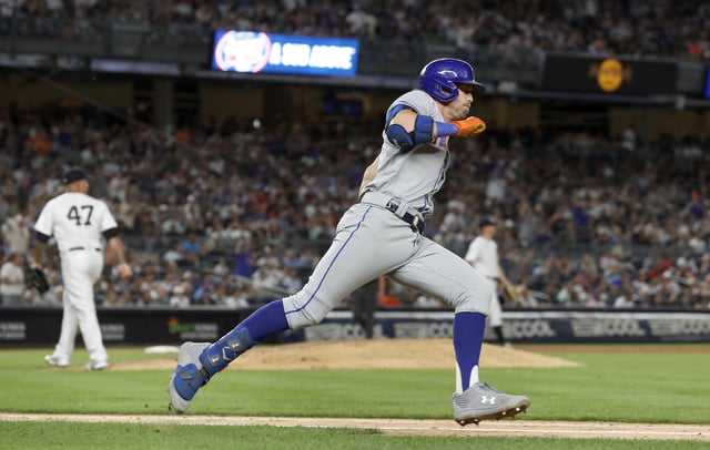 Jeff McNeil #1 of the New York Mets runs out his sixth inning run scoring double against Frankie Montas #47 of the New York Yankees at Yankee Stadium on August 23, 2022 in New York.