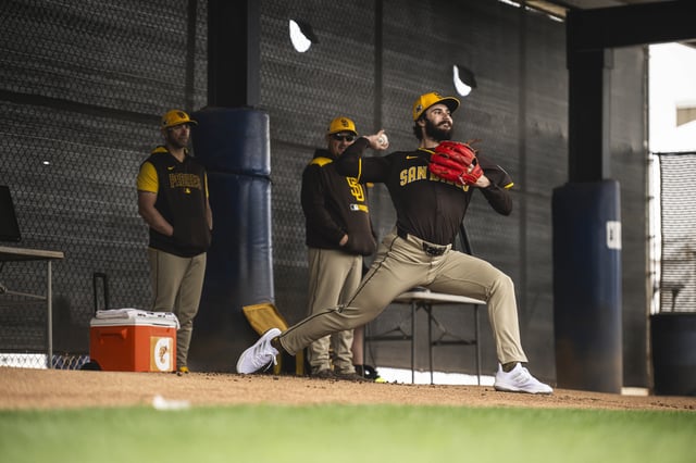 PEORIA, ARIZONA - FEBRUARY 12: Dylan Cease #84 of the San Diego Padres throws a bullpen session during the workout at the Peoria Sports Complex on February 12, 2025 in Peoria, Arizona.