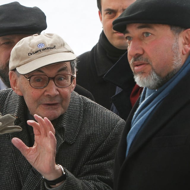 FILE - Israeli Foreign Minister Avigdor Liberman, right,, talks with Marian Turski, a Jewish journalist, after laying a wreath at the Monument to the Fighters of the Warsaw Ghetto in Warsaw, Poland, Jan. 15, 2012. (AP Photo/Czarek Sokolowski, File)