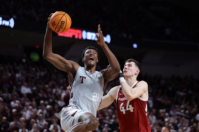 Pharrel Payne #21 of the Texas A&amp;M Aggies shoots the ball against Zvonimir Ivisic #44 of the Arkansas Razorbacks during the first half at Reed Arena on February 15, 2025 in College Station, Texas.