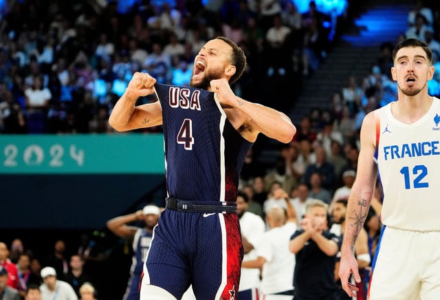 United States shooting guard Stephen Curry celebrates in the second half against France in the men's basketball gold medal game during the Paris 2024 Olympic Summer Games.