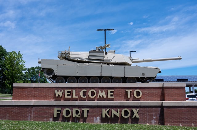 An M1 Abrams tank sits on a pedestal above the entrance signage to Fort Knox, a US military installation, on May 31, 2021 in Fort Knox, Kentucky.