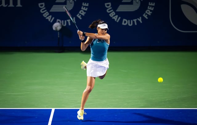 Raducanu plays a backhand against Muchová.
