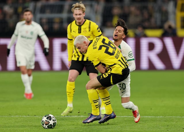 Soccer Football - Champions League - Knockout Phase Playoff - Second Leg - Borussia Dortmund v Sporting CP - Signal Iduna Park, Dortmund, Germany - February 19, 2025 Borussia Dortmund's Julian Ryerson in action with Sporting CP's Biel REUTERS/Wolfgang Rattay