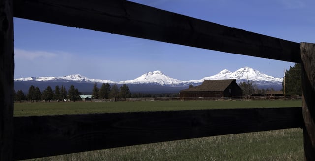 FILE - A view of four our central Oregon Cascade Mountain Range peaks, from left, Broken Top, South Sister, Middle Sister and North Sister, as seen from near Sisters, Ore., April 24, 2018. (AP Photo/Don Ryan, File)