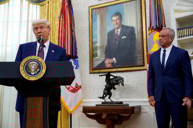 U.S. President Donald Trump speaks in the Oval Office of the White House next to Robert F. Kennedy Jr., on the day Kennedy is sworn in as secretary of Health and Human Service, in Washington, D.C., U.S., February 13, 2025. REUTERS/Nathan Howard/File Photo