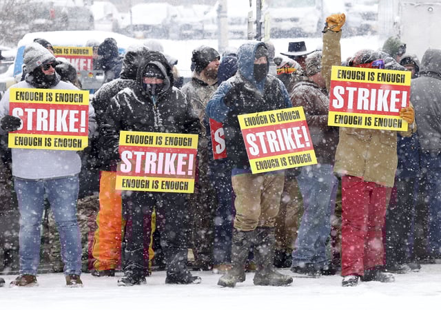 Officers at Auburn Correctional Facility stood in inclement weather on Wednesday, the second day of their strike, to protest unsafe working conditions in Auburn, N.Y., Feb. 19, 2025.