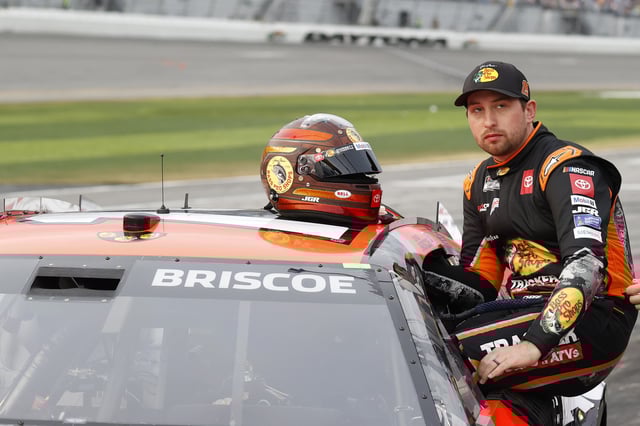 Feb 16, 2025; Daytona Beach, Florida, USA; NASCAR Cup Series driver Chase Briscoe (19) prepares to get in the car after a rain delay for the Daytona 500 at Daytona International Speedway. Mandatory Credit: Peter Casey-Imagn Images/File Photo