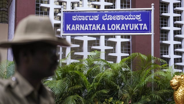 A policeman stands guard at the Lokayukta office, in Bengaluru, 