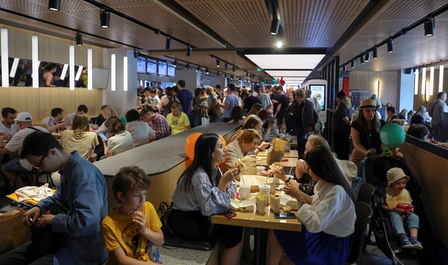 People visit the new restaurant "Vkusno & tochka", which opens following McDonald's Corp company's exit from the Russian market, in Moscow, Russia June 12, 2022. REUTERS/Evgenia Novozhenina/File photo