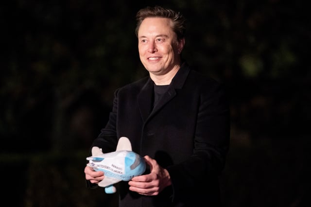 Elon Musk displays a stuffed Air Force One toy while returning to the White House along with U.S. President Donald Trump, in Washington, D.C., U.S., February 19, 2025. REUTERS/Nathan Howard/File Photo