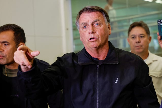 Brazil's former President Jair Bolsonaro reacts after the departure of his wife Michelle Bolsonaro for the inauguration of U.S. President Donald Trump at the Brasilia International Airport, in Brasilia, Brazil January 18, 2025. REUTERS/Adriano Machado/File Photo