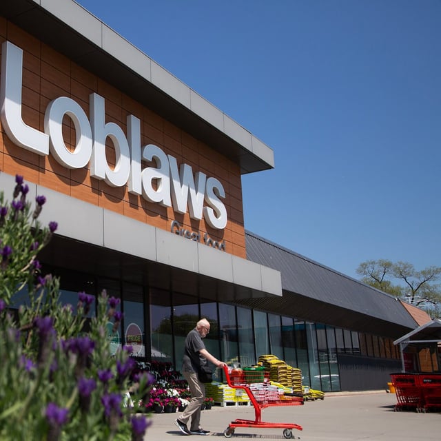 A customer wheels out a load of groceries from the Loblaws grocery store at Leslie Street and Lakeshore Boulevard in Toronto, Ontario on May 16, 2024.