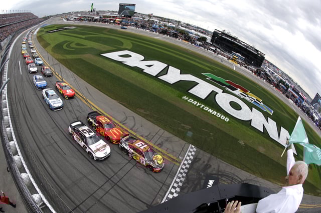 Chase Briscoe, driver of the #19 Bass Pro Shops Toyota leads the field to the green flag to start the NASCAR Cup Series Daytona 500 at Daytona International Speedway on February 16, 2025 in Daytona Beach, Florida.
