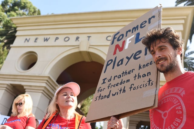 Former Minnesota Vikings NFL player Chris Kluwe joins a small group of protestors outside the Pelican Hill Country Club where US Vice President Mike Pence is scheduled to attend a luncheon fundraiser, in Newport Beach, California, October 9, 2017.