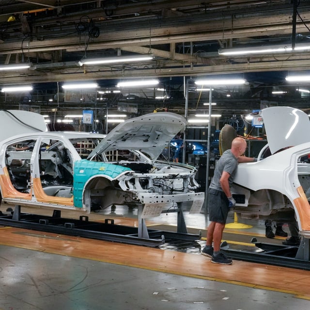 Cars pass along the assembly line at the Stellantis plant in Brampton, Ont. on Friday July 21, 2023. THE CANADIAN PRESS/Chris Young