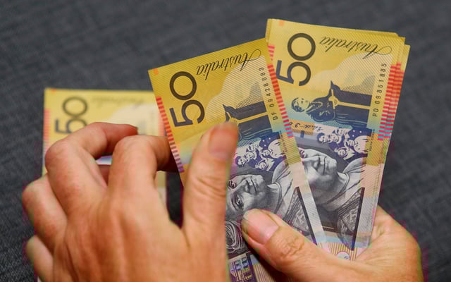 FILE PHOTO; Australian dollars are seen in an illustration photo February 8, 2018. REUTERS/Daniel Munoz/File Photo