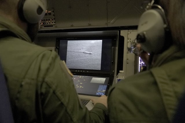 FILE - Crew members aboard a French Navy Atlantique 2 surveillance plane patrolling over the Baltic Sea to protect undersea cables and pipelines from sabotage, on Jan. 23, 2025. (AP Photo/John Leicester, File)