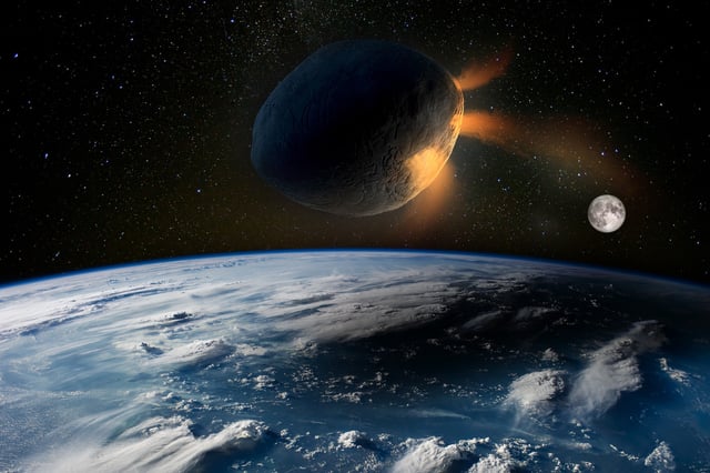 A stock image showing an illustration of an asteroid approaching Earth.