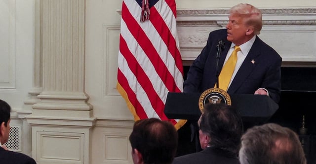 Maine Governor Janet Mills stands as U.S. President Donald Trump speaks during a business session with U.S. governors who are in town for the National Governors Association's (NGA) annual winter meeting, at the White House in Washington, D.C., U.S., February 21, 2025. REUTERS/Leah Millis