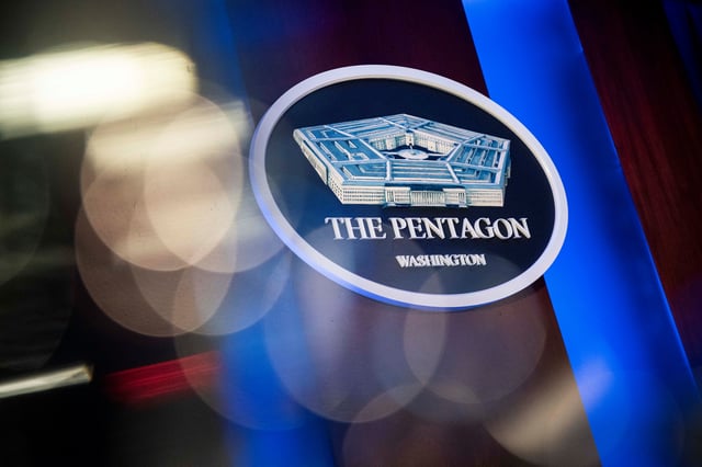 The Pentagon logo is seen behind the podium in the briefing room at the Pentagon in Arlington, Virginia, U.S., January 8, 2020. REUTERS/Al Drago/File Photo