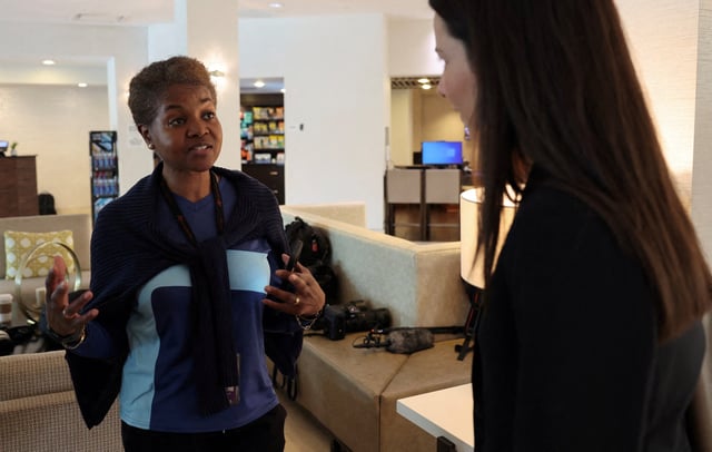 Associated Press White House reporter Darlene Superville is told by a member of the Trump administration that AP is barred from joining White House press pool coverage, in West Palm Beach, Florida, U.S., February 16, 2025. REUTERS/Kevin Lamarque/File Photo