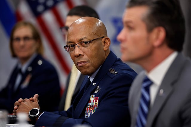 Chairman of the Joint Chiefs of Staff General Charles Brown Jr. listens to Secretary of Defense Pete Hegseth answer reporters' questions before a meeting with Israeli Prime Minister Benjamin Netanyahu to the Pentagon during an honor cordon on February 5, in Arlington, Virginia.
