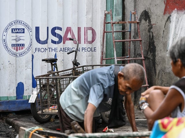 A USAID sign seen on a container in Manila, Philippines. USAID provides assistance to countries around the world.