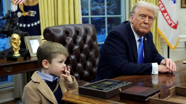FILE PHOTO: U.S. President Donald Trump looks on as X Æ A-12, Elon Musk's son, stands beside him in the Oval Office of the White House in Washington, D.C., U.S., February 11, 2025. REUTERS/Kevin Lamarque/File Photo
