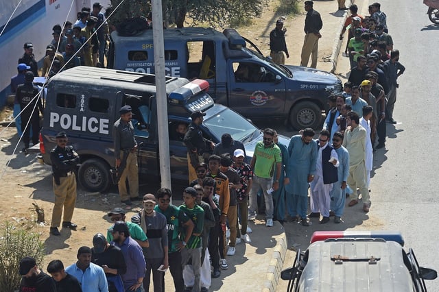 Spectators queue to enter the National Stadium in Karachi, Pakaistan on February 19, 2025, ahead of the ICC Champions Trophy one-day international cricket match between Pakistan and New Zealand.