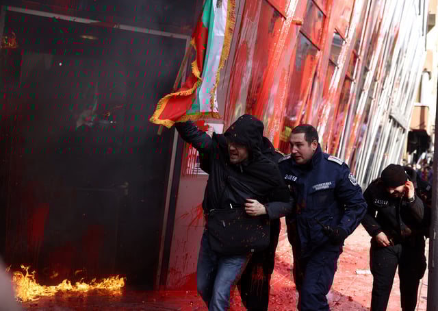 Police detain a supporter of Bulgaria's ultranationalist Revival party as he tried to storm the office of the European Commission during a demonstration against the country's plans of joining the euro zone, in Sofia, Bulgaria February 22, 2025. REUTERS/Stoyan Nenov