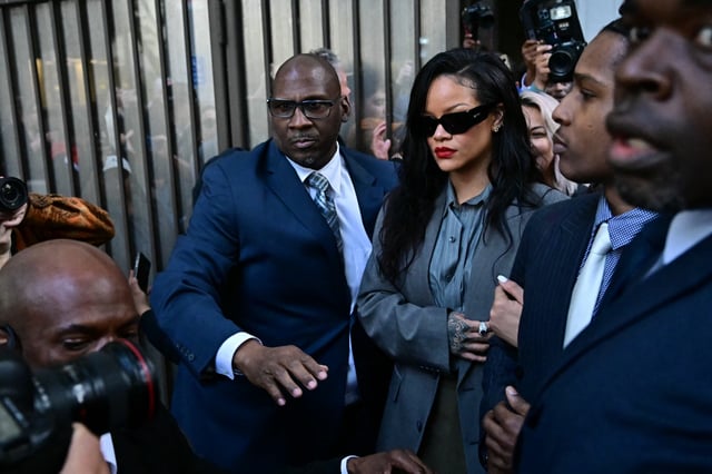 RIhanna (center) and A$AP Rocky, pictured leaving his felony gun assault trial in Los Angeles on Tuesday, praised her boyfriend's parenting in a new Harper's Bazaar interview.