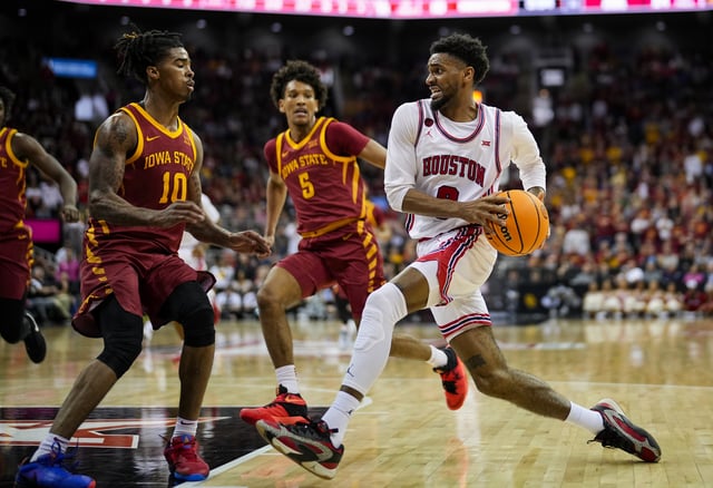 Mylik Wilson #8 of the Houston Cougars shoots against Keshon Gilbert #10 of the Iowa State Cyclones during the first half of the Big 12 Men&#39;s Basketball Tournament championship game at T-Mobile Center on March 16, 2024 in Kansas City, Missouri.