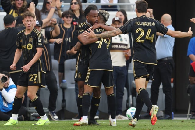 LAFC’s Jeremy Ebobisse, center, celebrates his winning goal by hugging teammate Denis Bouanga in a 1-0 victory over Minnesota United FC on Saturday, Feb. 22, 2025, at BMO Stadium.  (Photo by Raul Romero Jr., Contributing Photographer)