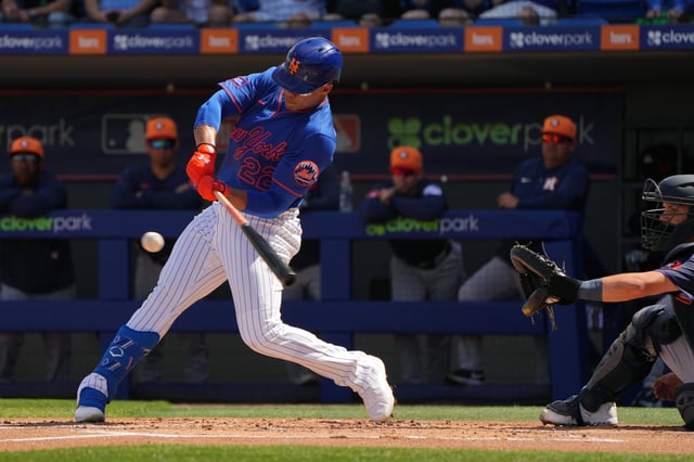 Feb 22, 2025; Port St. Lucie, Florida, USA; New York Mets outfielder Juan Soto (22) hits a home run in his first at bat for the Mets against the Houston Astros in the first inning at Clover Park. Mandatory Credit: Jim Rassol-Imagn Images