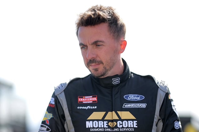 Frankie Muniz #33 driver of the NUGGETTRAP.COM Ford waits on the grid during qualifying for the NASCAR Craftsman Truck Series Fr8 208 at Atlanta Motor Speedway on February 21, 2025 in Hampton, Georgia.