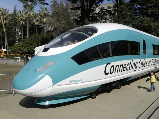 A full-scale mock-up of a high-speed train, is displayed at the Capitol in Sacramento, Calif., on Feb. 26, 2015. The California High-Speed Rail Authority's biennial business plan, released Tuesday, Feb. 8, 2022, shows the estimated cost of the project rising by about $5 billion, compared to the 2020 plan, up to as much as $105 billion. (AP Photo/Rich Pedroncelli, File)