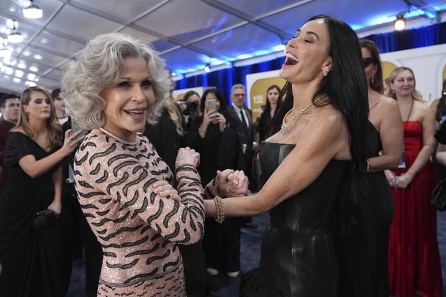 Jane Fonda, left, and Demi Moore arrive at the 31st annual Screen Actors Guild Awards at the Shrine Auditorium in Los Angeles.