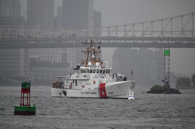 A U.S. Coast Guard ship sits near the United Nations headquarters in New York City on September 18, 2023. The agency is searching for missing person in the waters off Breezy Point after a boat got into difficulty on Sunday.