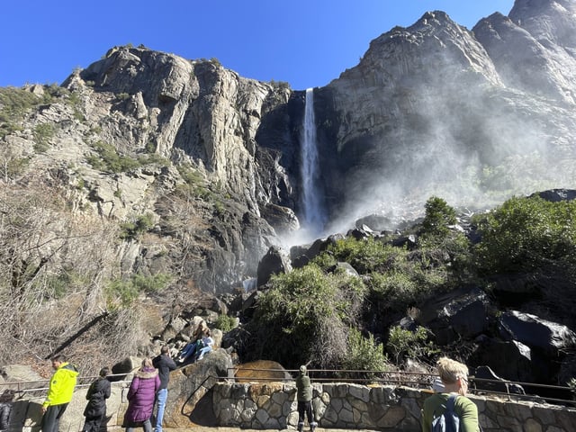 Visitors take in a view of Bridalveil Fall on Thursday, February 20, 2025, in Yosemite National Park, California.