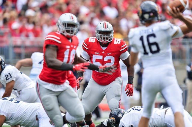 COLUMBUS, OH - SEPTEMBER 13: Donovan Munger #52 of the Ohio State Buckeyes plays on defense against the Kent State Golden Flashes on September 13, 2014 in Columbus, Ohio.