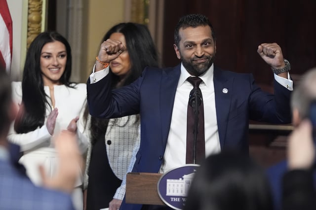 Kash Patel, President Donald Trump's new director of the FBI, reacts as Alexis Wilkins watches during Patel's ceremonial swearing-in, Friday, Feb. 21, 2025, in the Indian Treaty Room at the Eisenhower Executive Office Building on the White House campus in Washington. (AP Photo/Mark Schiefelbein)