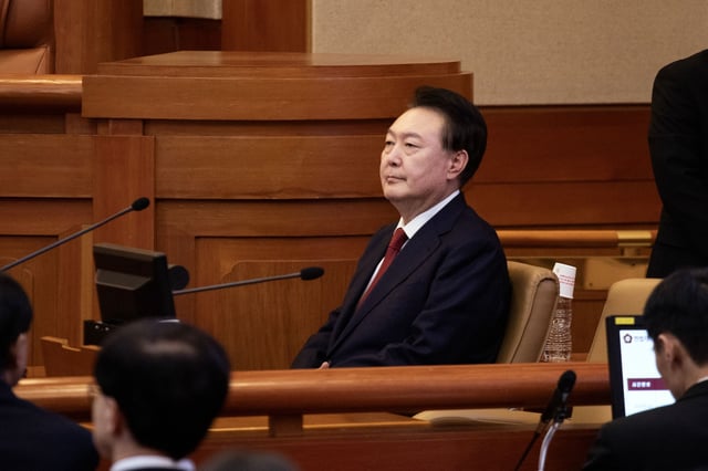 Yoon Suk Yeol, South Korea's president, attends a hearing at the Constitutional Court of Korea in Seoul, South Korea, on Tuesday, Jan. 21, 2025. Yoon made his first appearance at his impeachment trial on Tuesday, with security ramped up following the Capitol Hill-like rioting during his appearance at another court at the weekend. Photographer: Woohae Cho/Bloomberg via Getty Images