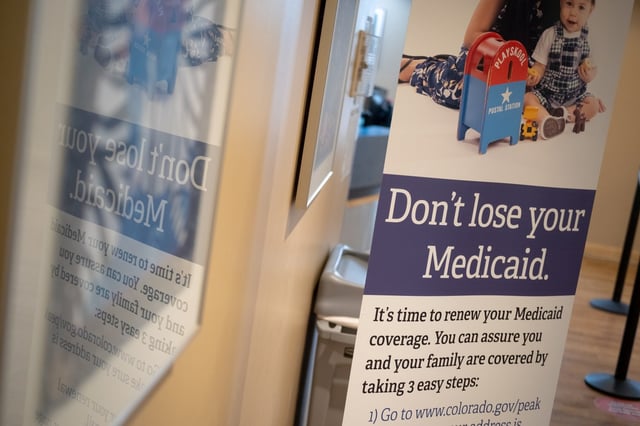 A Medicaid sign is displayed in the hallway at Clinica Family Health on Thursday, May 2, 2024, in Adams County, Colo. The health clinic, where 57 percent of patients were on Medicaid at one point, was forced to shutter some services and lay off nearly 50 people due to pandemic-era Medicaid programs ending for patients, leaving many uninsured and the clinic feeling the effects. Eli Imadali/Special to The Denver Post)