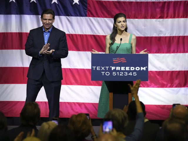FILE - Florida Gov. Ron DeSantis, left, looks on as his wife Casey DeSantis speaks at the final of three presidential campaign stops in South Carolina on Friday, June 2, 2023, in Greenville, S.C. (AP Photo/Meg Kinnard, File)