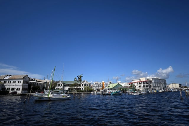 Boats are anchored at a port in Belize City, Belize, on Nov. 5, 2022. (Photo by Johan Ordonez/AFP via Getty Images)