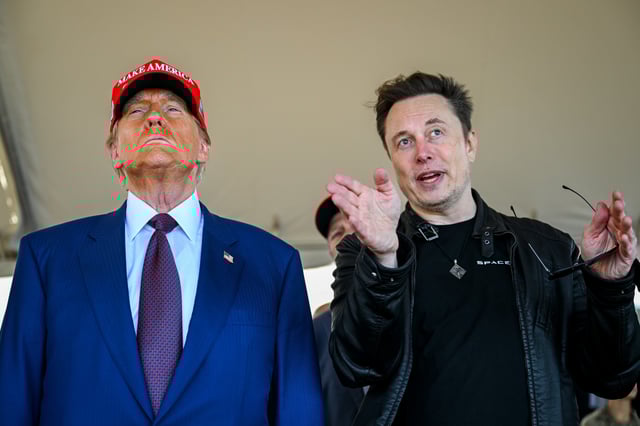 Elon Musk speaks with U.S. President-elect Donald Trump as they watch the launch of the sixth test flight of the SpaceX Starship rocket on November 19, 2024 in Brownsville, Texas.