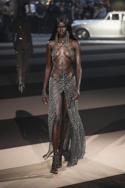 A model wears a creation as part of the Dsquared2 Fall/Winter 2025-2026 men's and women's collection presented in Milan, Italy, Tuesday, Feb. 25, 2025. (AP Photo/Antonio Calanni)