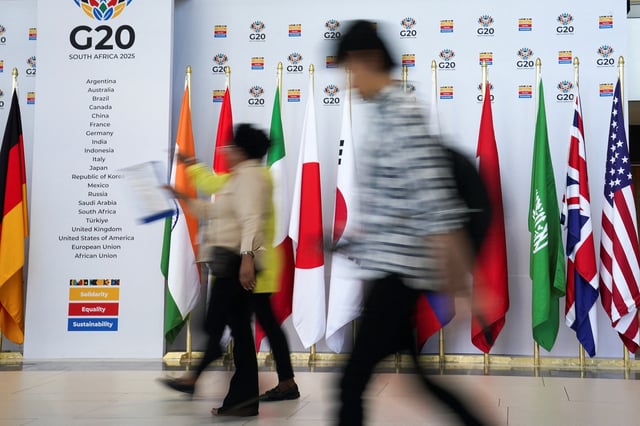 People walk at the Cape Town International Convention Centre during the G20 Finance Ministers meeting in Cape Town, South Africa February 25, 2025. REUTERS/Nic Bothma