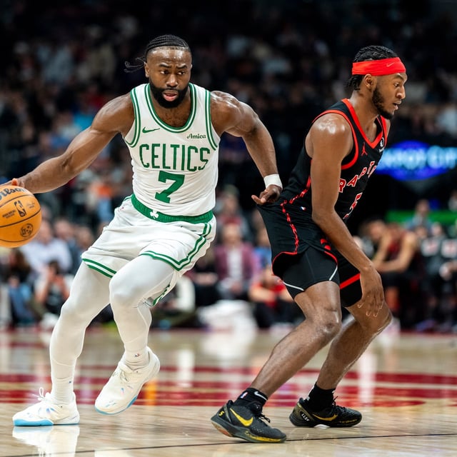 TORONTO, CANADA - FEBRUARY 25: Jaylen Brown #7 of the Boston Celtics dribbles the ball during the first half against Immanuel Quickley #5 of the Toronto Raptors at Scotiabank Arena on February 25, 2025 in Toronto, Canada. NOTE TO USER: User expressly acknowledges and agrees that, by downloading and or using this photograph, User is consenting to the terms and conditions of the Getty Images License Agreement. (Photo by Kevin Sousa/Getty Images)